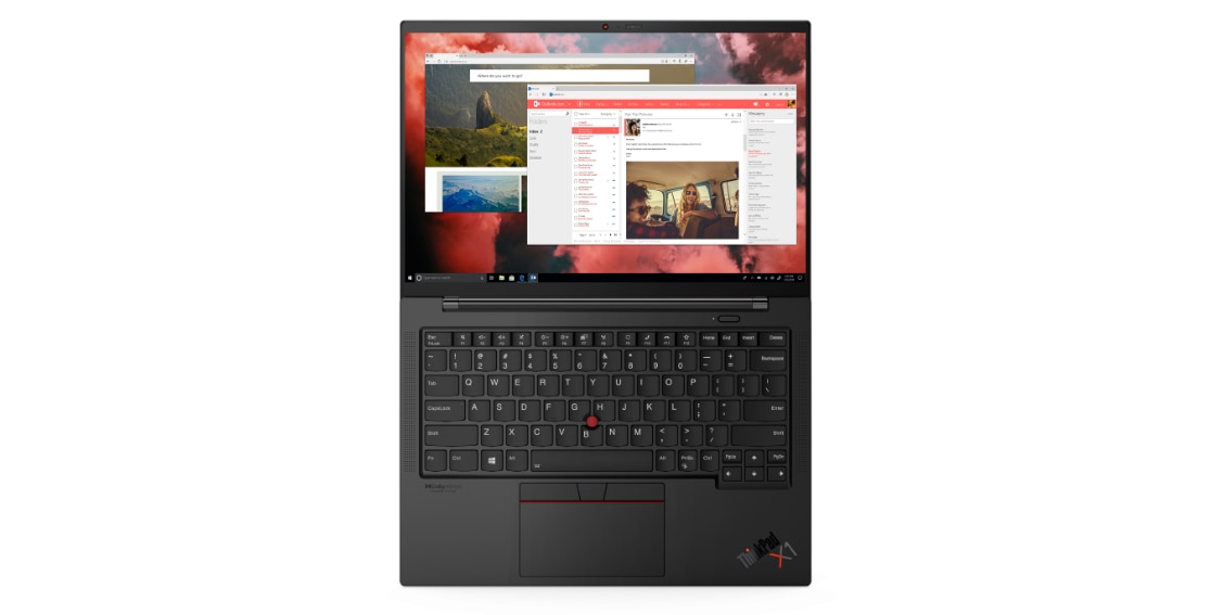 Overhead shot of Lenovo ThinkPad X1 Carbon Gen 9 laptop open 180 degrees, showing display, keyboard, and TrackPad and product logos. 